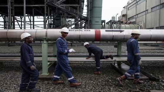 Employees of the Afam VI power plant walk past a gas pipeline at the plant in Port Harcourt on September 29, 2015. Afam VI power plant is owned by the Shell Petroleum Development Company of Nigeria (SPDC) and maintained by Dietsmann company. Nigeria is Africa's largest producer, accounting for roughly two million barrels of crude daily. Shell has blamed repeated oil thefts and sabotage of key pipelines as the major cause of spills and pollution in the oil-producing region. AFP PHOTO / FLORIAN PLAUCHEUR (Photo credit should read FLORIAN PLAUCHEUR/AFP/Getty Images)