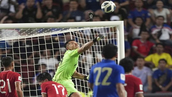 Singapore goalkeeper Hassan Sunny saves the ball from Thailand's during their World Cup Asia qualifying match at Rajamangala national stadium in Bangkok, Thailand, Tuesday, June 11, 2024. Chinese football fans poured their love to a Singaporean goalkeeper's restaurant payment account after his performance in a game on Tuesday allows China takes a further step to be the World Cup 2026. (AP Photo/Pattarchai Pramarnpanich)